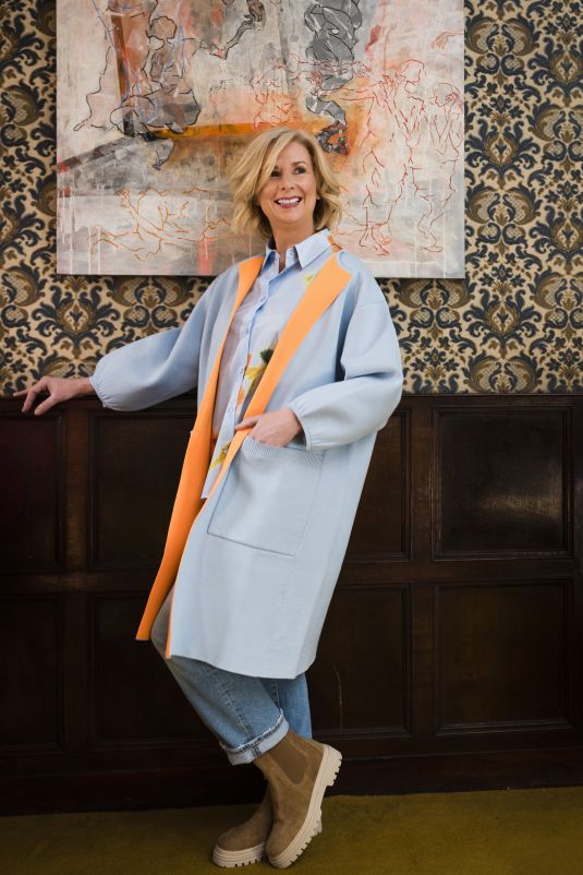 Fashionable woman poses for photoshoot in Grantham House